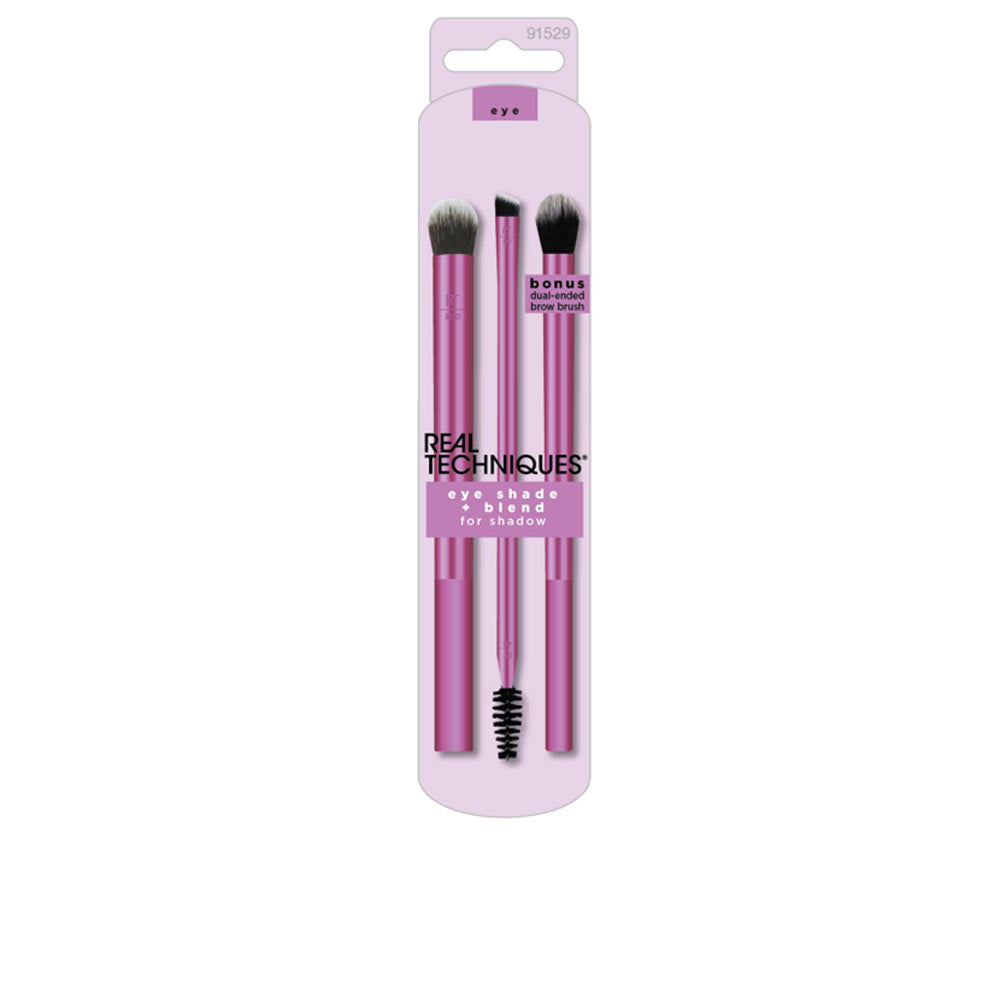 Real Techniques Three sleek pink makeup brushes with synthetic bristles and plastic handles, including a dual-ended brow brush