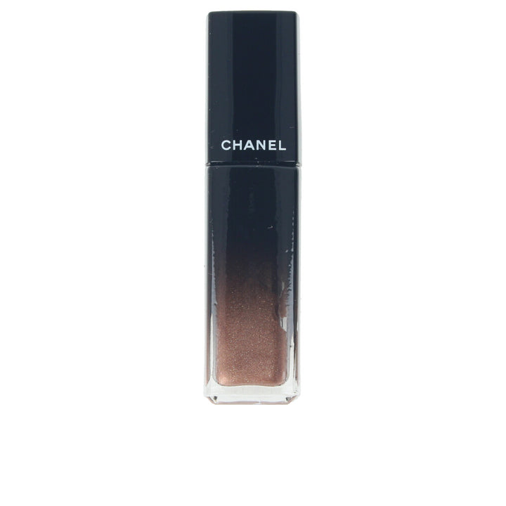 Small cosmetic bottle of high-shine liquid lip colour, warm brown shade, glossy finish