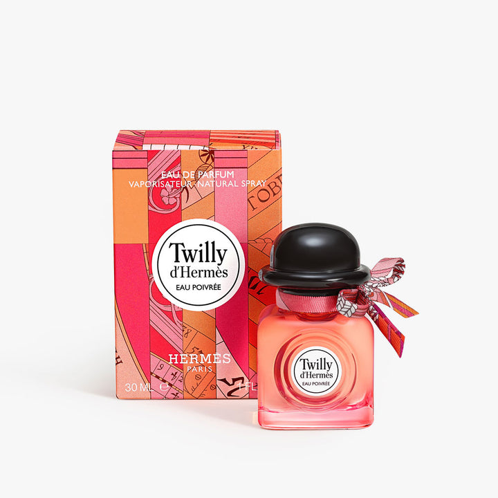 Square coral-hued 30 ml perfume bottle with hand-tied silk ribbon and silver cap