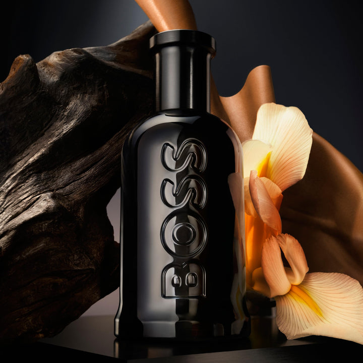 50 ml clear bottle of woody amber eau de parfum for the Man, amber liquid