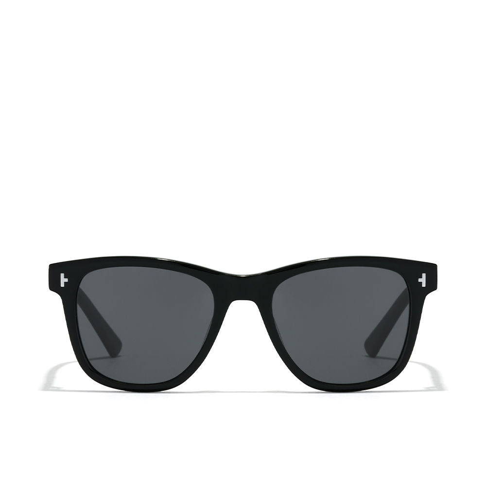 Translucent beige acetate unisex sunglasses with green polarized lenses and curved temples