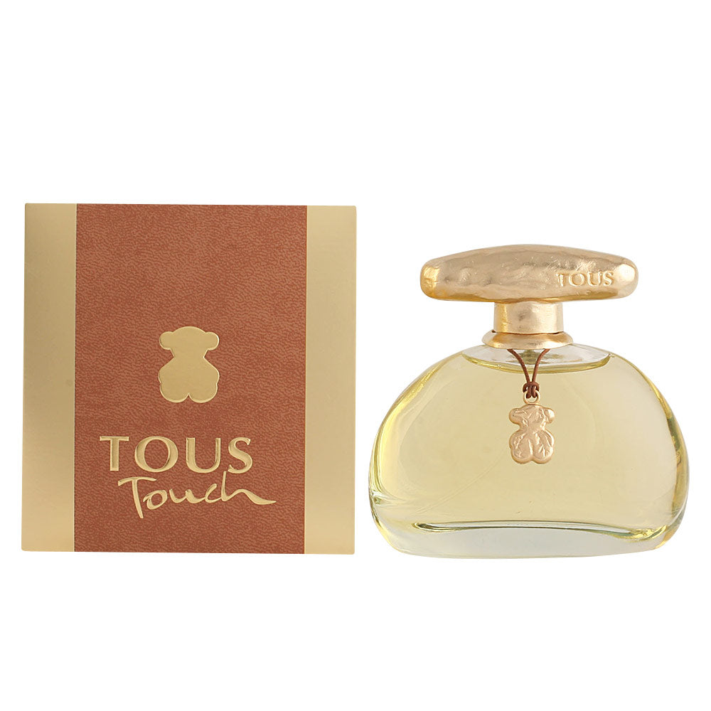 Oval glass perfume bottle, amber liquid, gold cap and charm, 100 ml