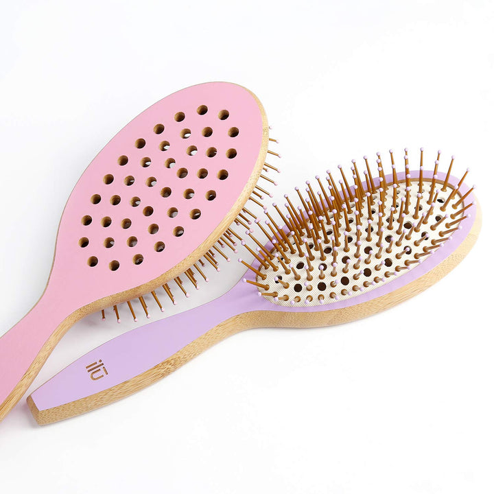 Oval bamboo hairbrush in lavender tone with vented cushion and anti‑static bristles