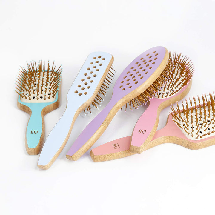 Oval bamboo hairbrush in lavender tone with vented cushion and anti‑static bristles