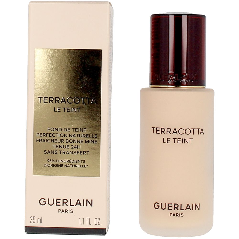 Frosted glass foundation bottle with dark brown embossed cap and gold-label rectangular box, Guerlain