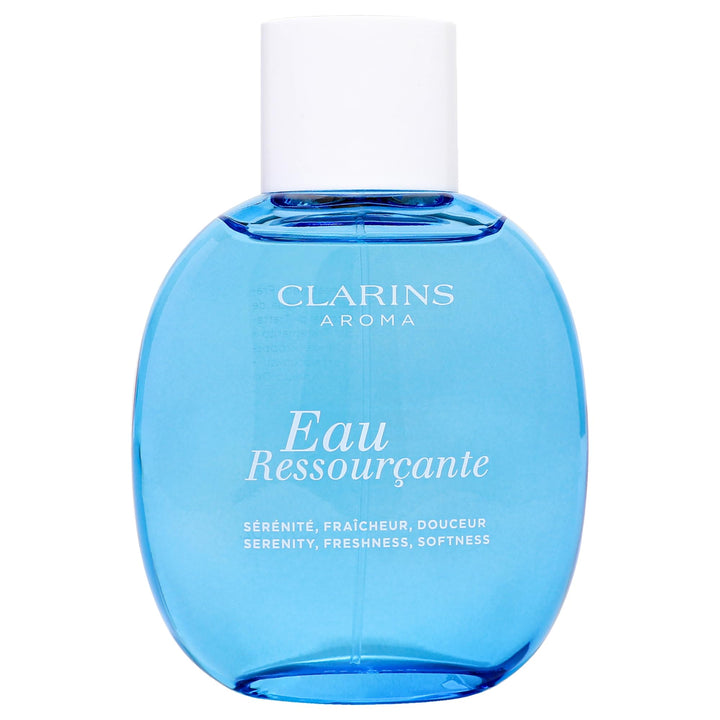 Dark blue elegant perfume bottle labeled Eau Ressourçante, floral-woody fragrance