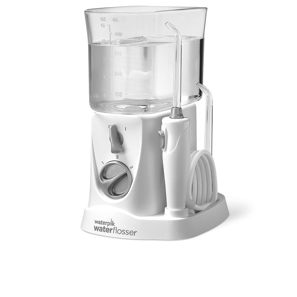 Compact travel water flosser with four nozzles and invertible reservoir, Unisex