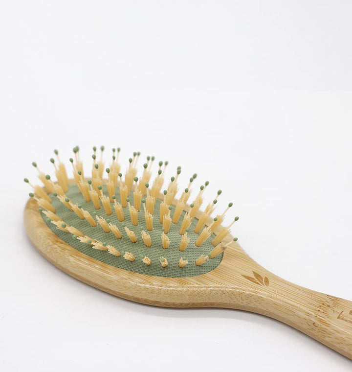 Small bamboo hairbrush with mixed nylon pins, compact travel size for Women