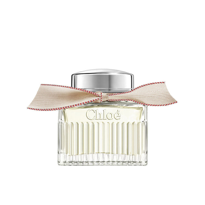 50 ml clear glass perfume bottle with beige ribbon and silver cap, floral scent