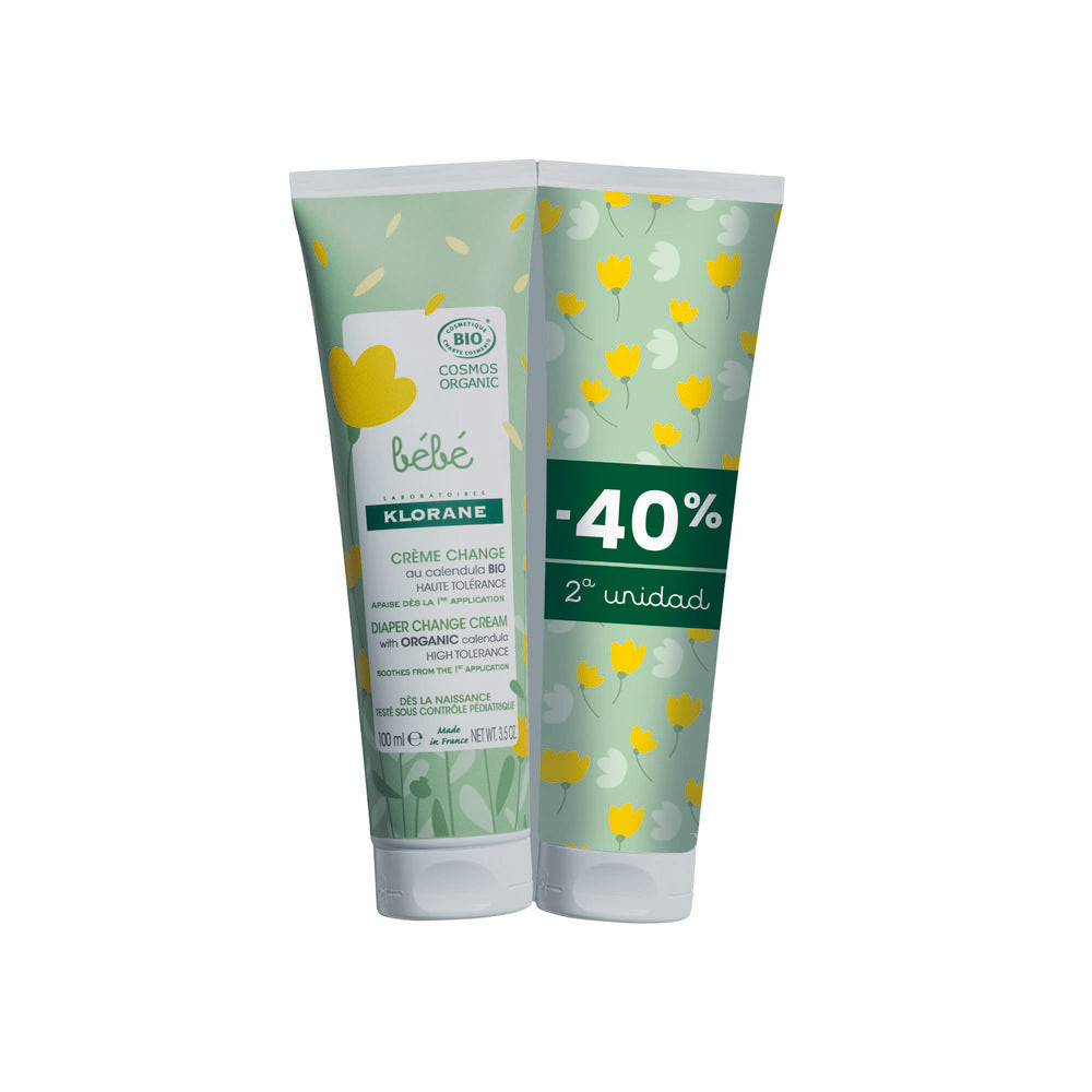Plastic tube diaper change cream in green with yellow white floral pattern, organic logo, discount label, multilingual text, Klorane