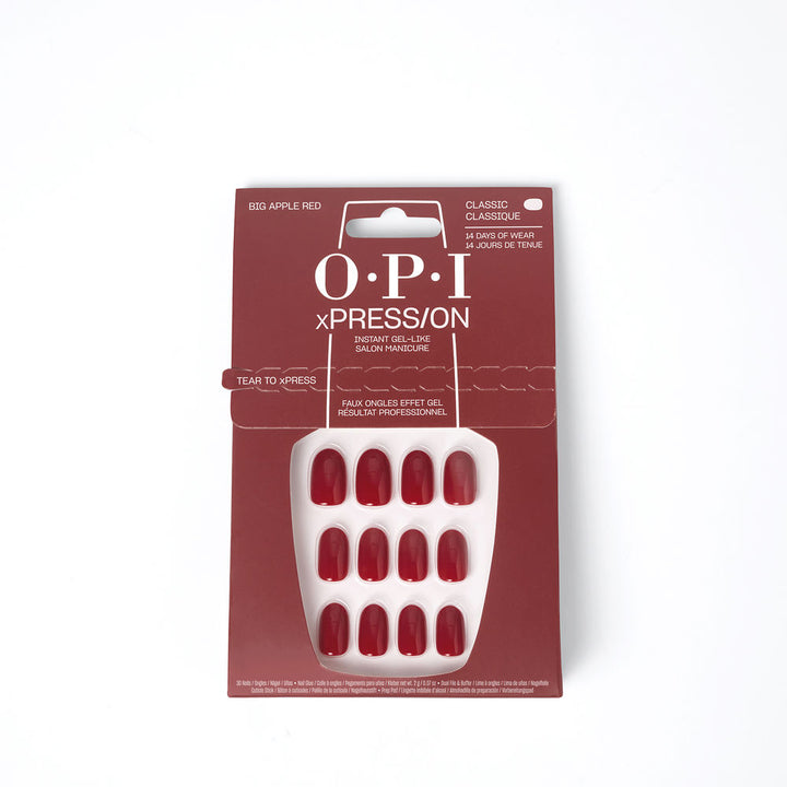 Thirty red adhesive press-on nails with buffer, glue and prep pad in kit
