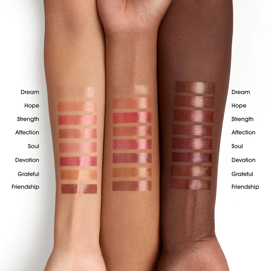 Bare Minerals hydrating satin lip gloss in clear tube with doe-foot applicator showing glossy, sheer finish