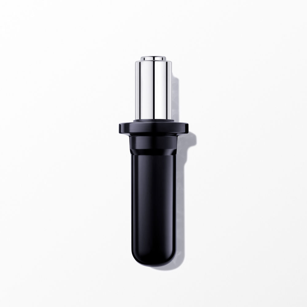 Lancôme lipstick in black and silver metal and plastic, cylindrical glossy finish with wider-based cap