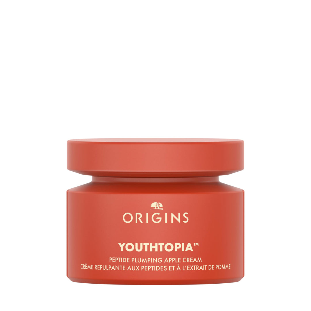 Cream-colored jar of peptide moisture cream with smooth texture and subtle luminous sheen, Origins