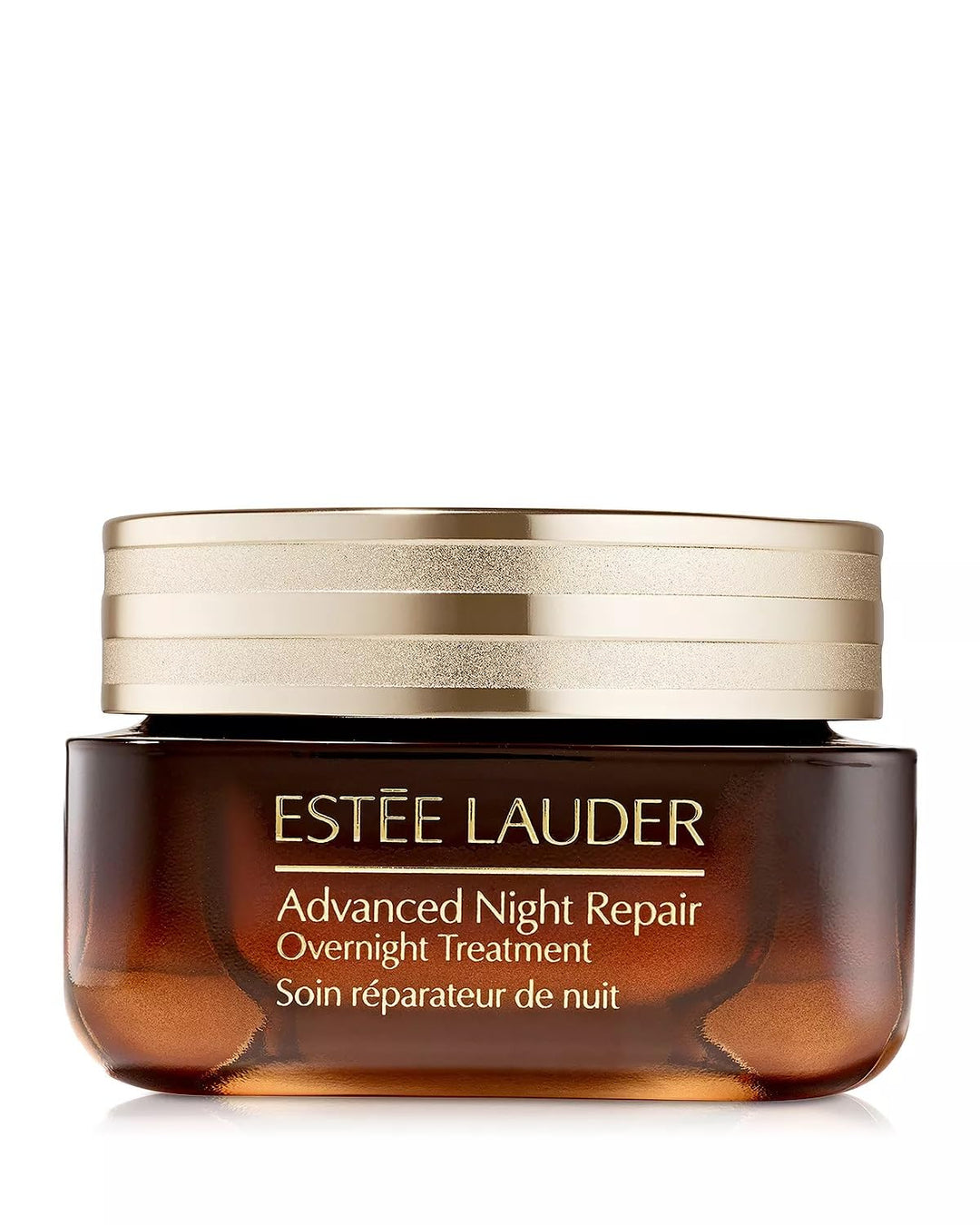 Glass jar of night treatment cream on linen, soft morning light, Estée Lauder visible label