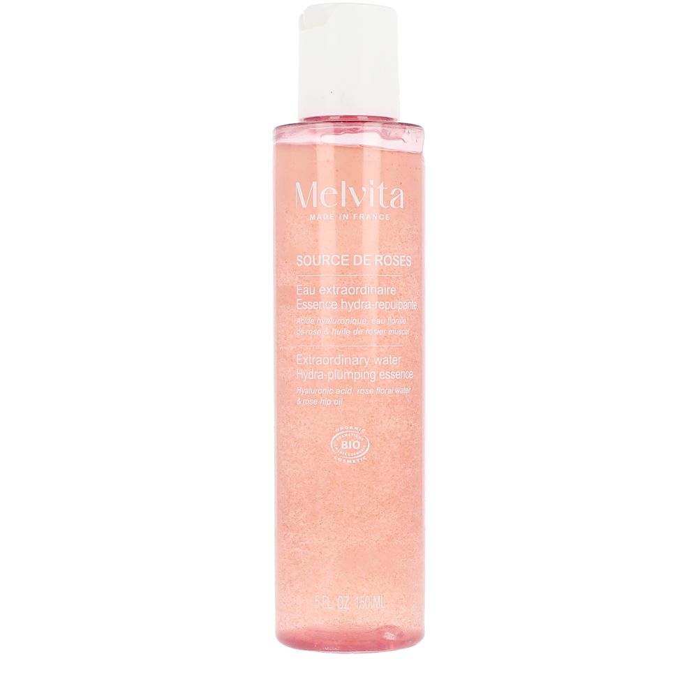 Melvita Transparent pink plastic bottle with suspended-particle liquid and white flip-top cap, minimalist modern skincare essence