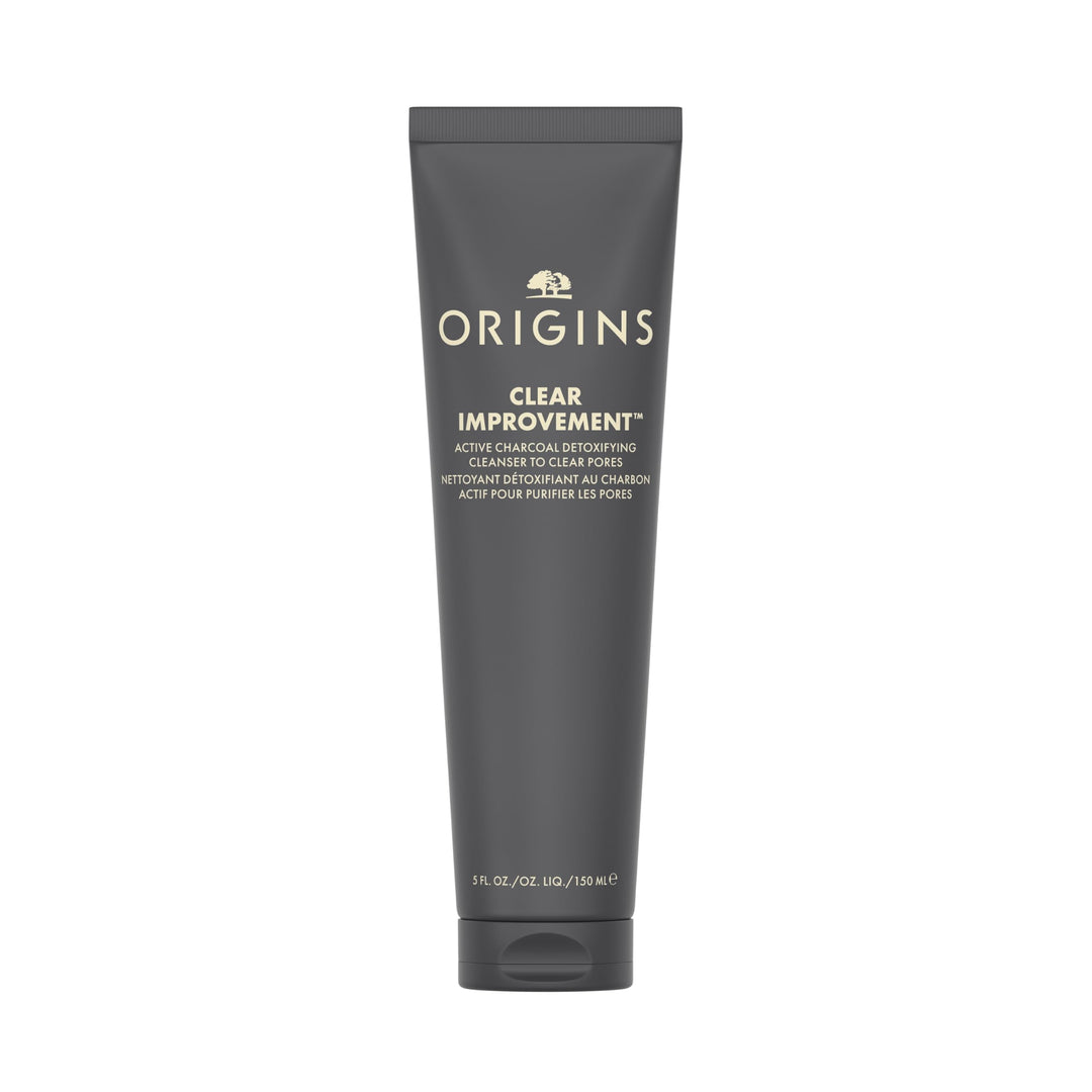 Tube of clear gel-to-foam face wash on neutral background, minimalist label and twist cap, Origins