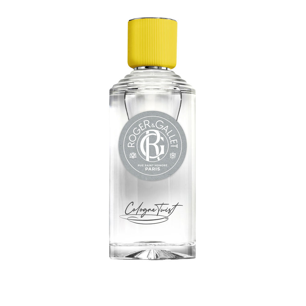 Roger & Gallet Transparent glass cologne bottle with clear yellow liquid, ribbed yellow cap, round gray label, black cursive text, presented .