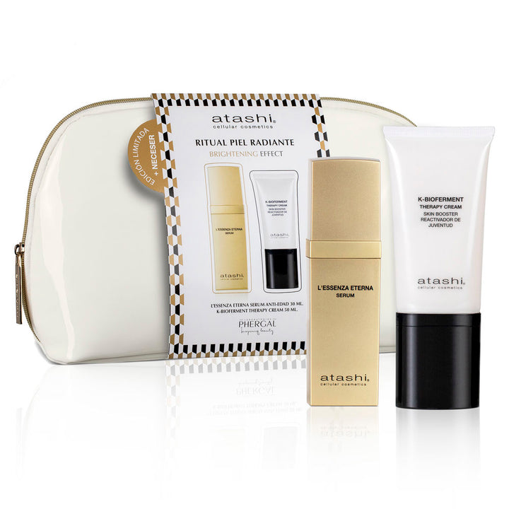 Small glass bottle with pump, golden oil-serum and botanical ingredients