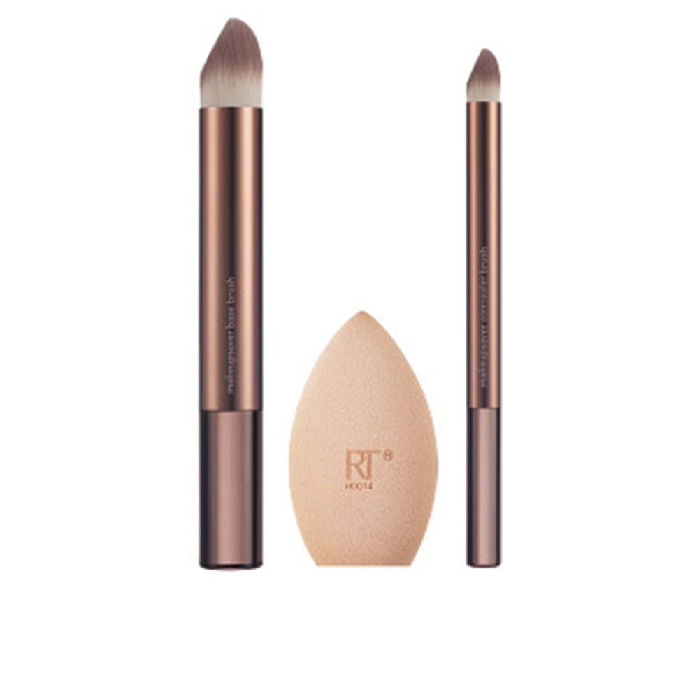 Real Techniques Sleek modern set with rose gold and beige handles, synthetic bristles, foam sponge, angled and dual-ended brushes.