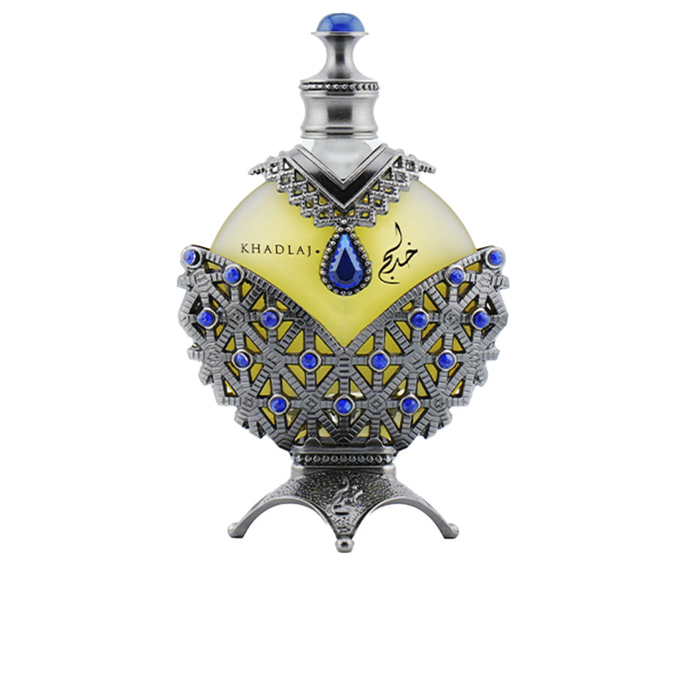 Ornate round glass perfume bottle with silver metal lattice, blue gem stopper, intricate base — Khadlaj