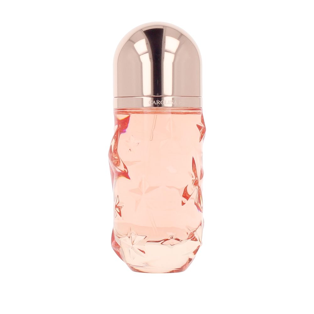 Carolina Herrera perfume bottle with star-embossed tinted glass, evening fragrance