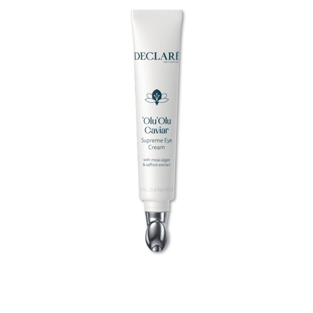 Declaré Minimalist white plastic tube with metallic applicator tip, printed text and small flower logo visible.