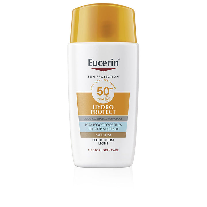 Eucerin White and gold plastic sunscreen lotion bottle with flip-top cap, modern clean label and graphics