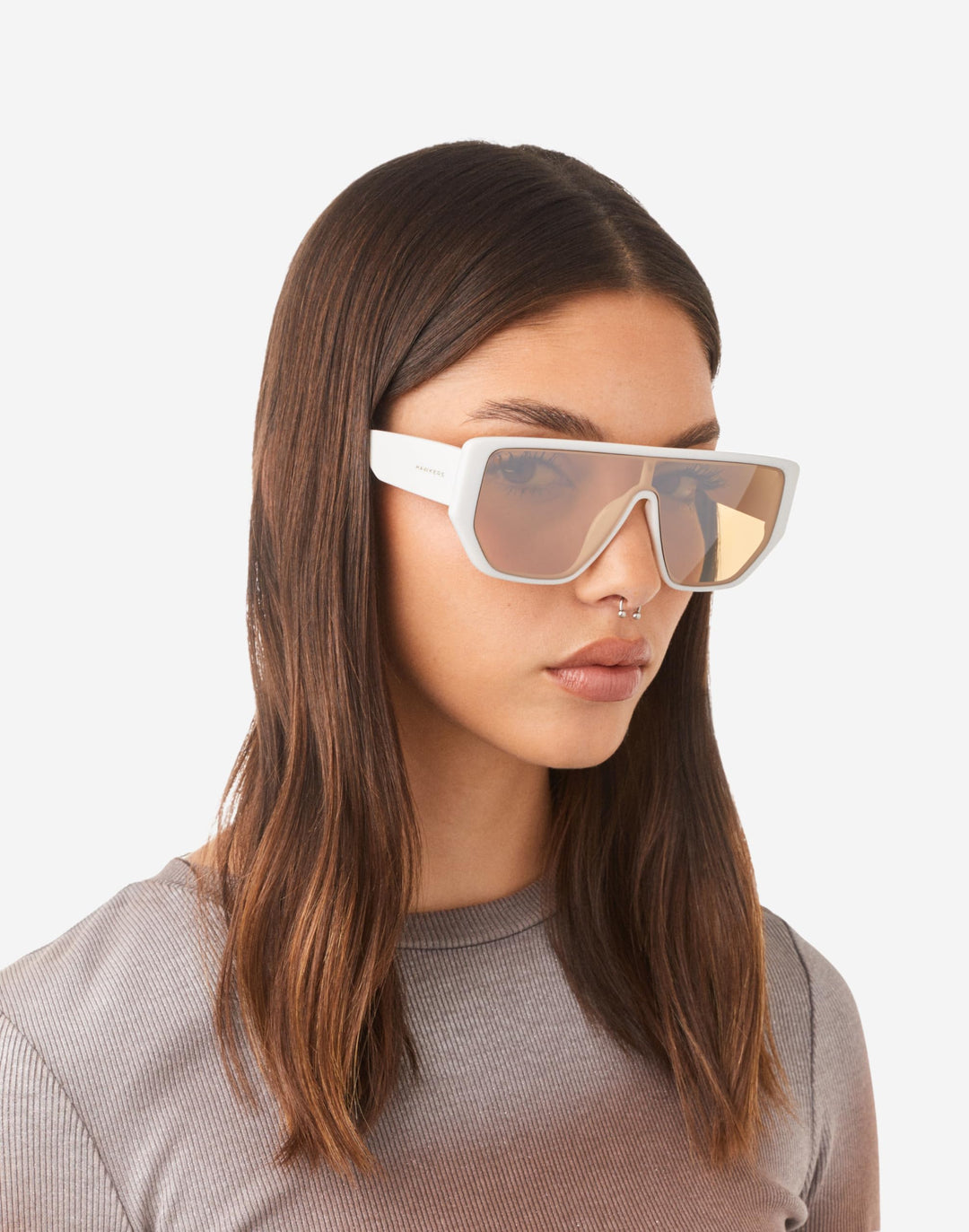 Hawkers futuristic rectangular sunglasses with white frame, single continuous brown lens, angular flat-top cutout bridge