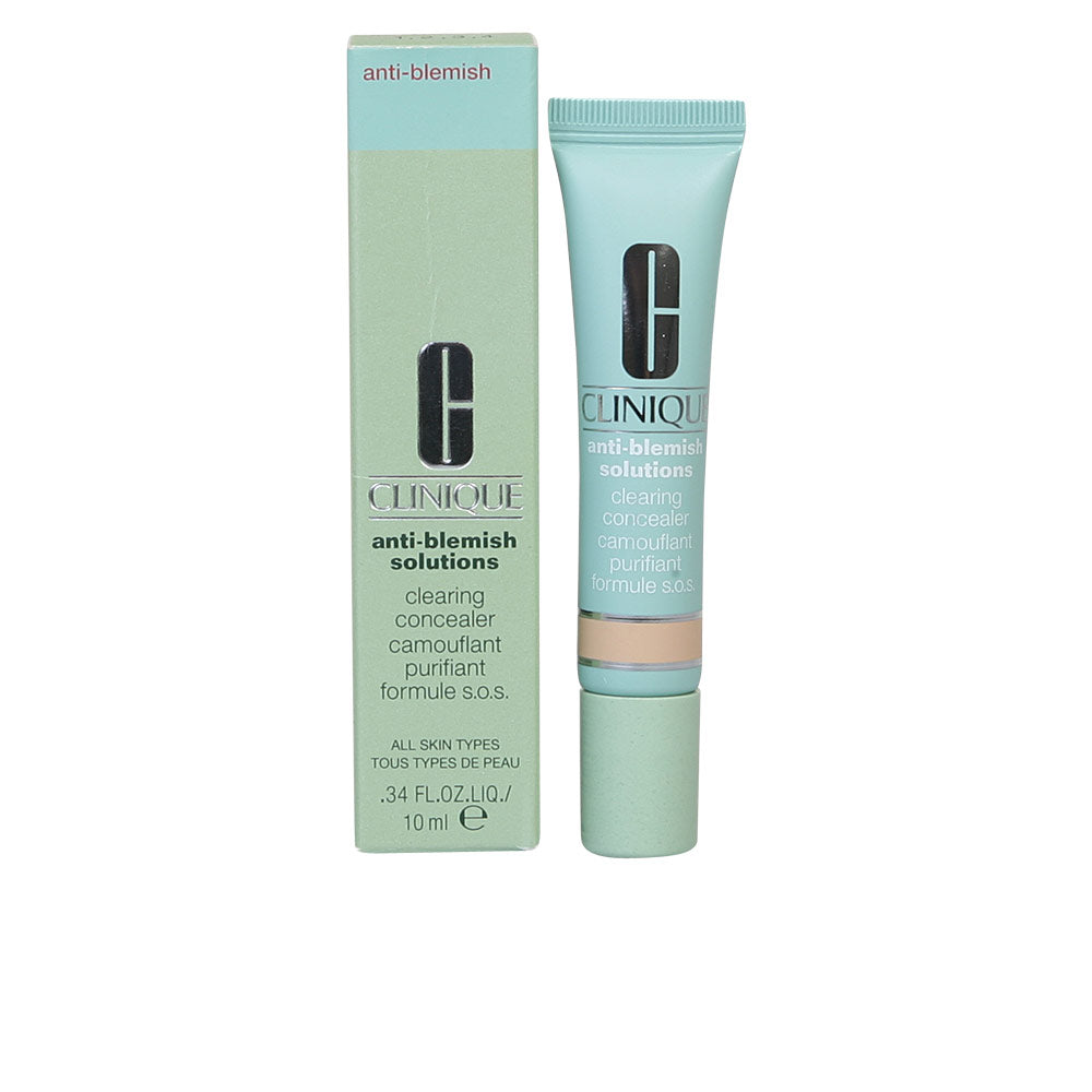 Minimalist light green concealer tube with screw cap beside matching cardboard box, Clinique branding visible