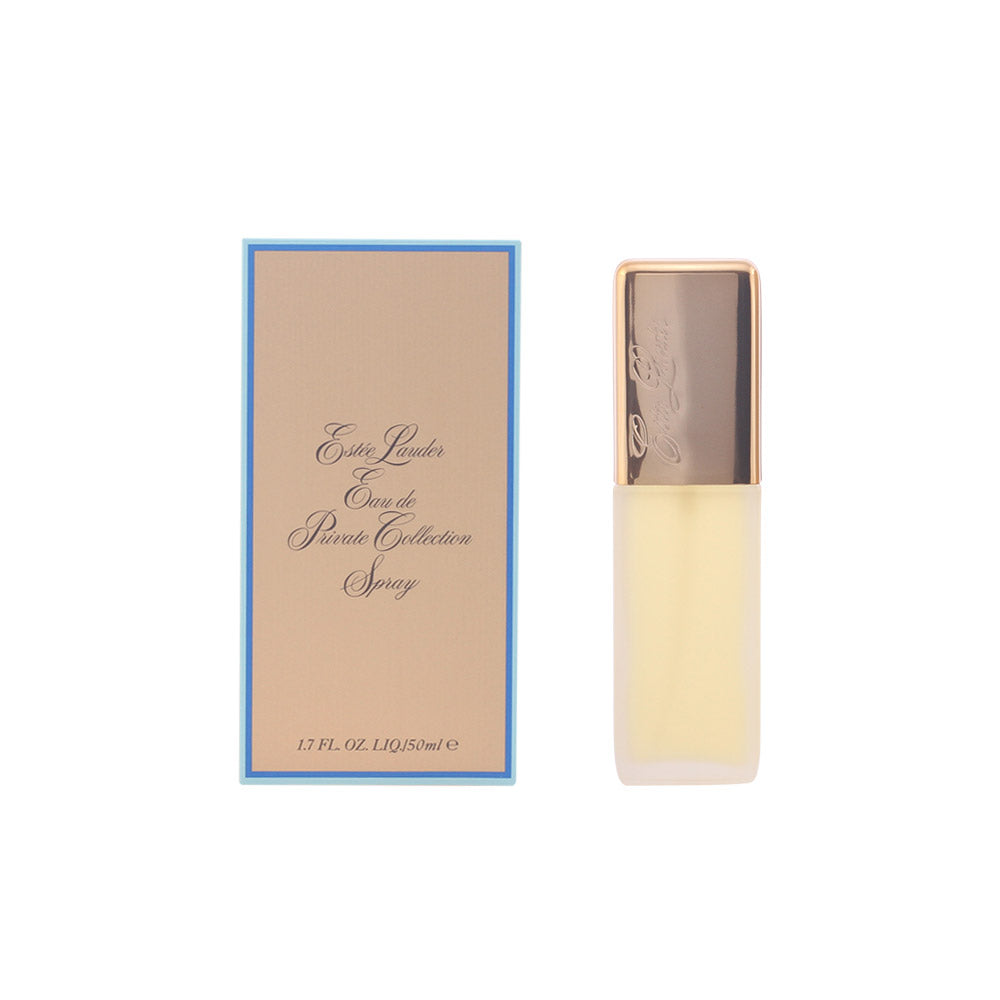 Estée Lauder Beige glass spray bottle with gold cap beside blue rectangular box, handcrafted glass and cardboard