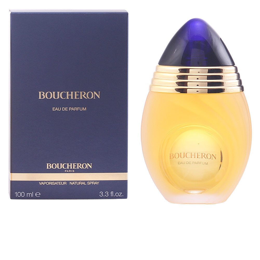 Clear 100 ml floral eau de parfum bottle; polished gold-finish cap, elegant silhouette