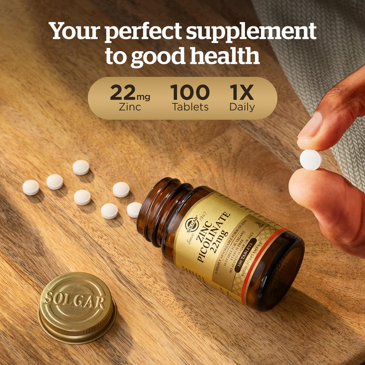 Solgar Amber glass supplement bottle with gold screw cap, beige label with black and gold text, classic apothecary style