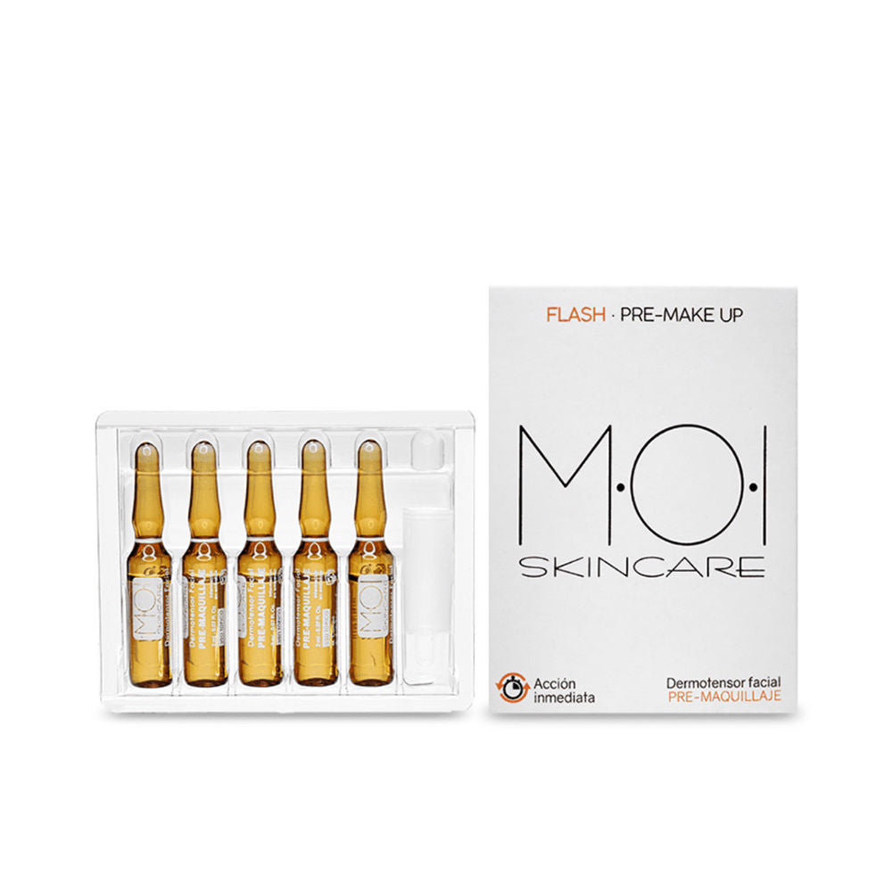 Five amber glass ampoules in a clear plastic tray beside a compact white box, minimalist clinical styling — Moi.