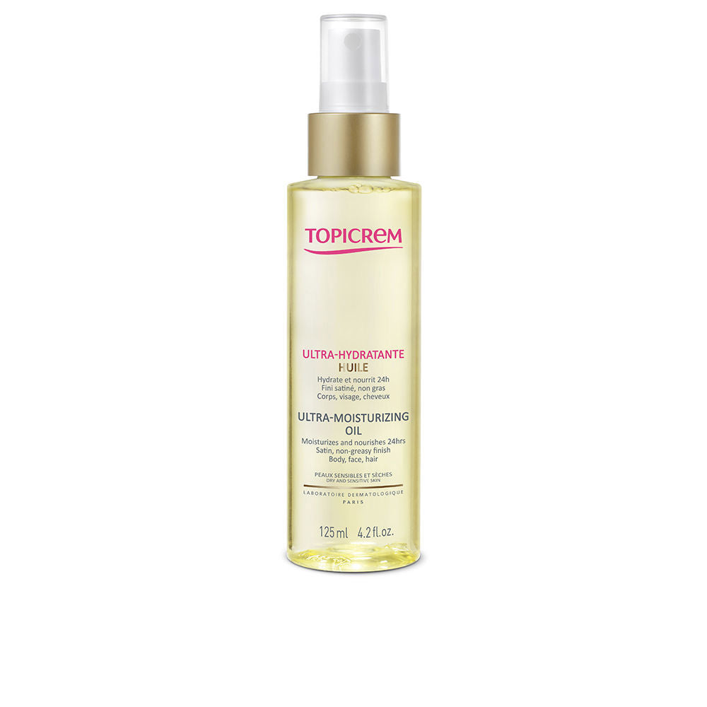 Topicrem Transparent plastic spray bottle of yellow-gold moisturizing oil with minimalist white and pink labeling