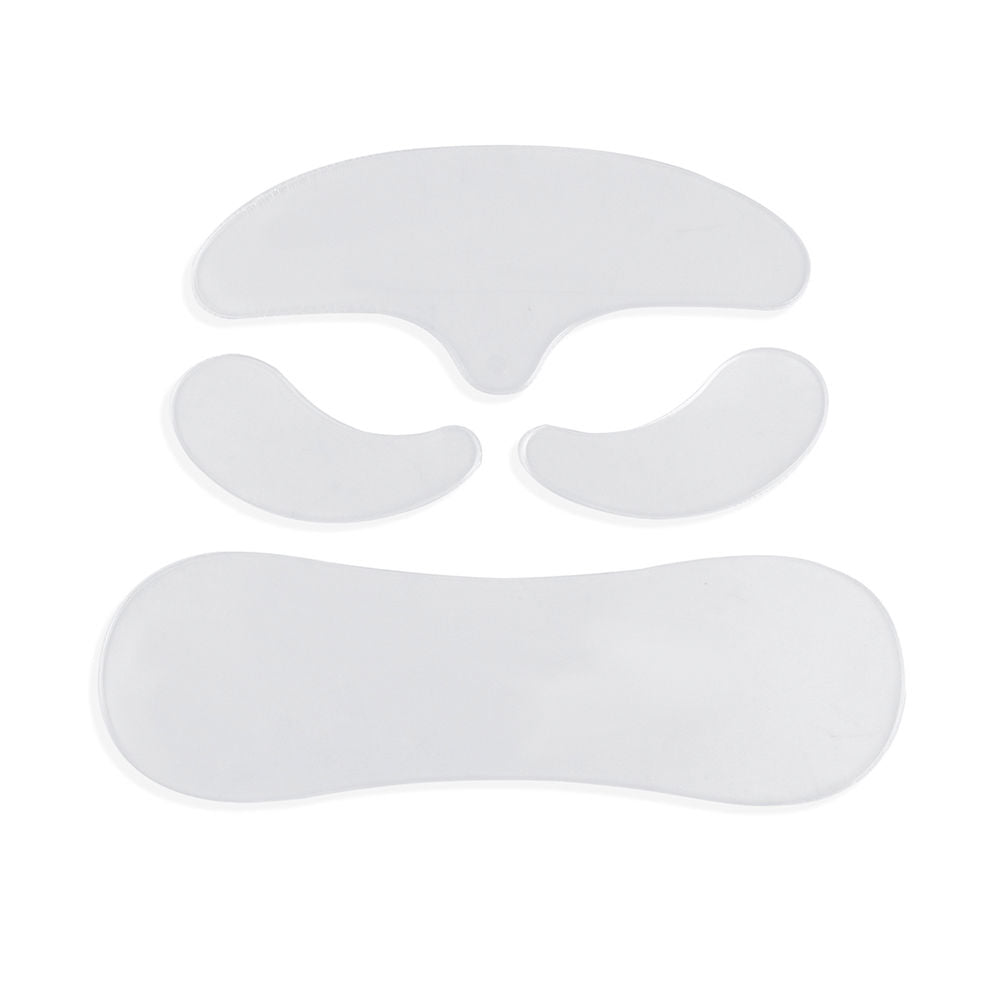 Paloma Beauties Four thin white gel pads with curved shapes and smooth edges, arranged as separate pieces