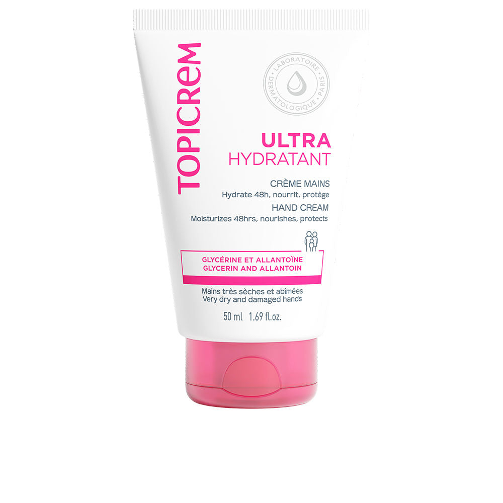 Topicrem Minimalist white and pink plastic hand cream tube with flip cap resting on clean surface
