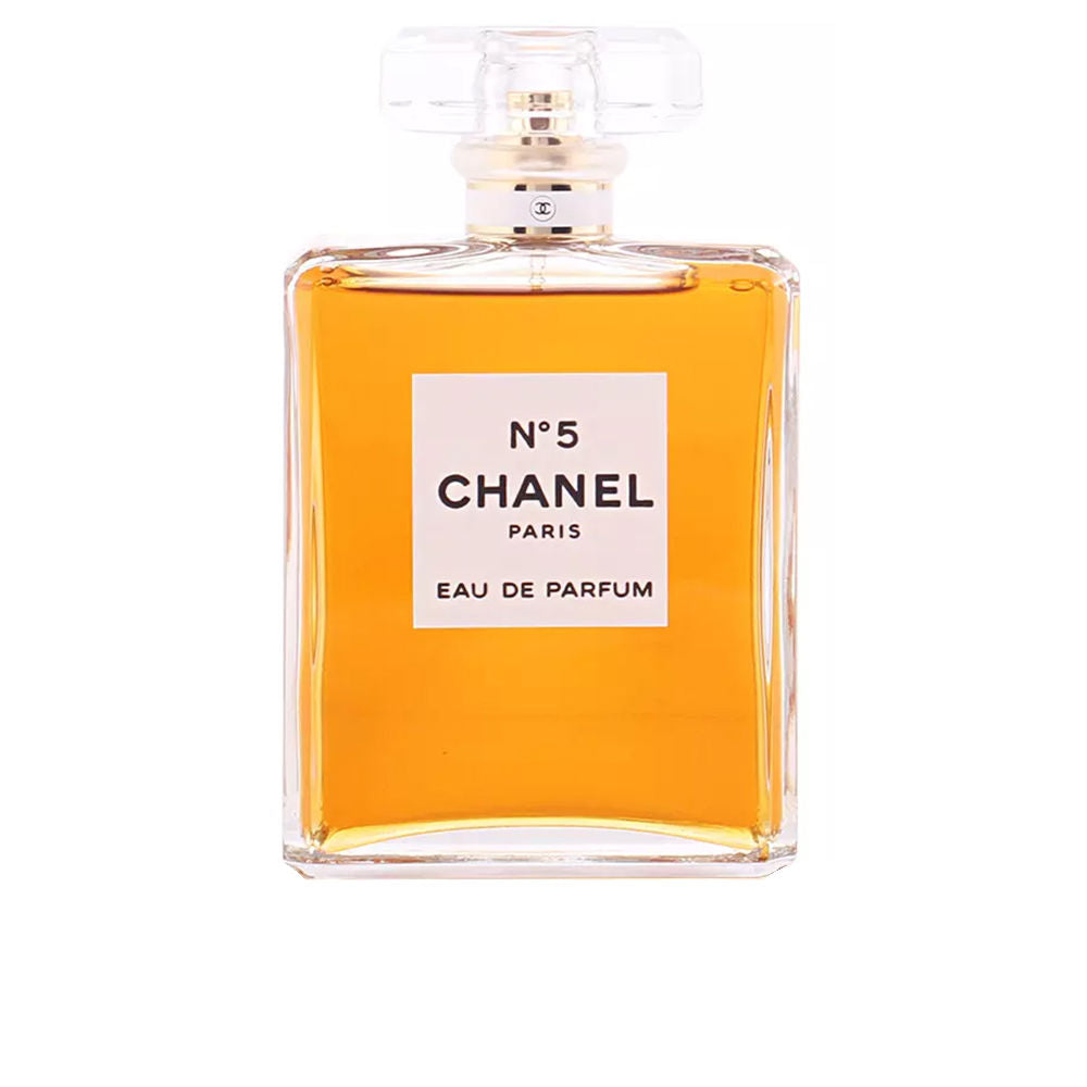 Chanel Amber liquid in a rectangular transparent glass perfume bottle with square label and clear cap