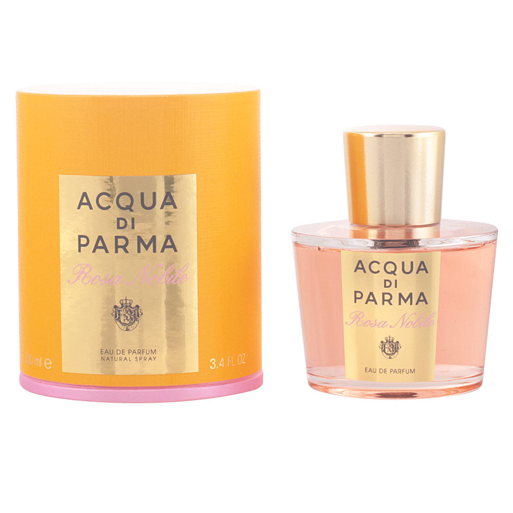 Glass 100 ml perfume bottle with pale rose-coloured fragrance and minimalist label
