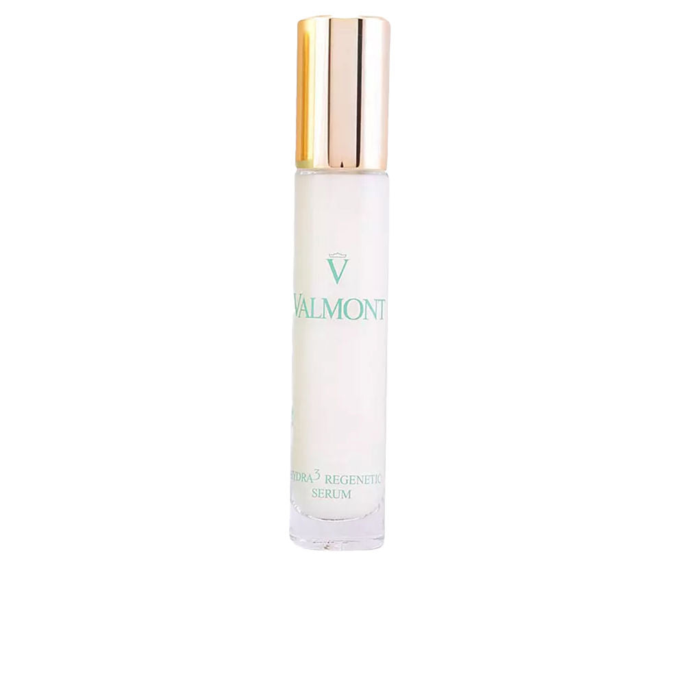 White glass cylindrical serum bottle with gold cap, minimalist elegant finish — branded Valmont