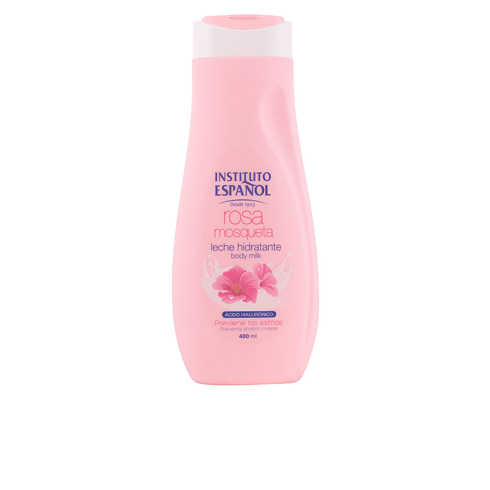 Instituto Español Soft pink plastic body lotion bottle with flip-top cap, floral graphic and clean text labels, smooth surface