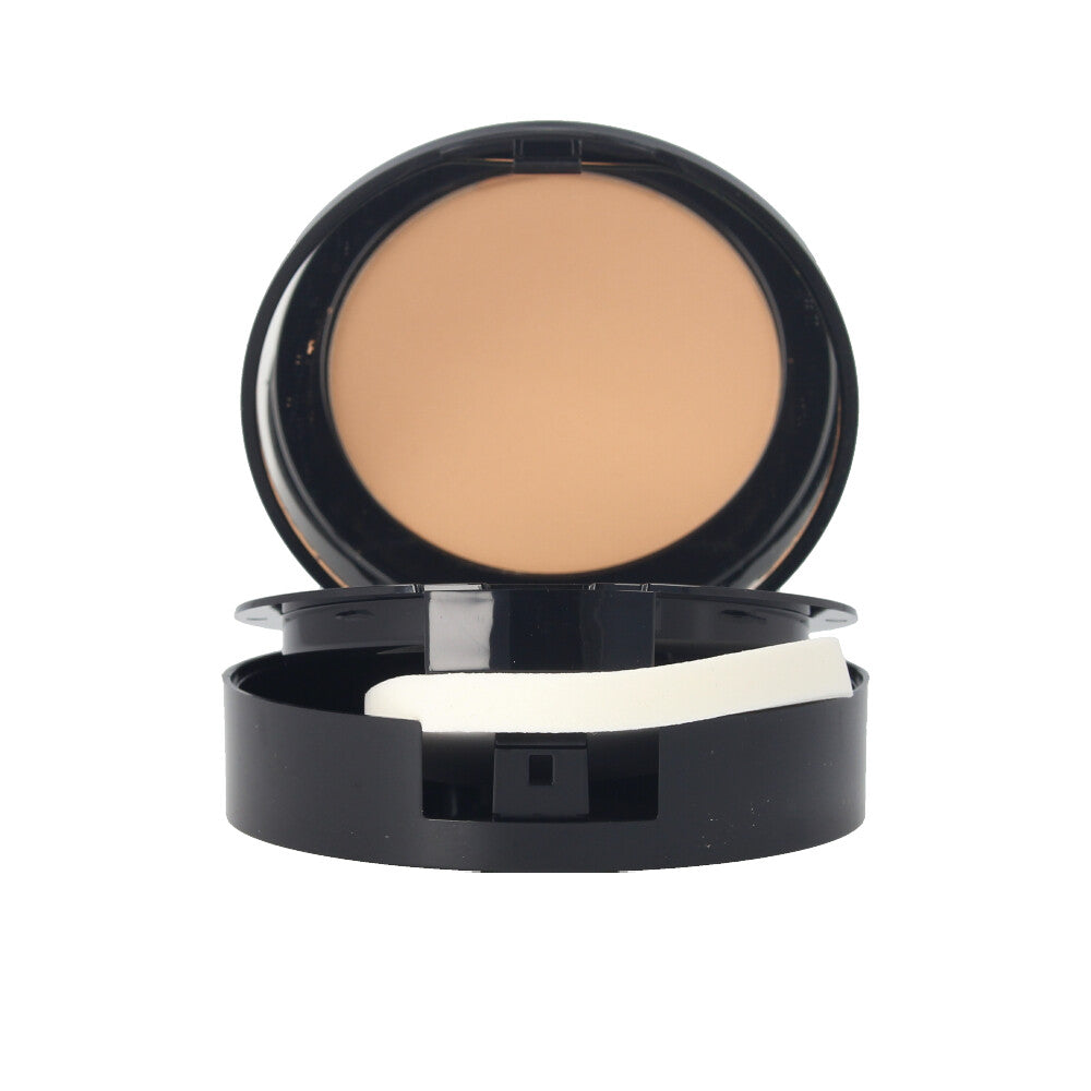 Pressed mineral compact powder in warm shade with application sponge visible