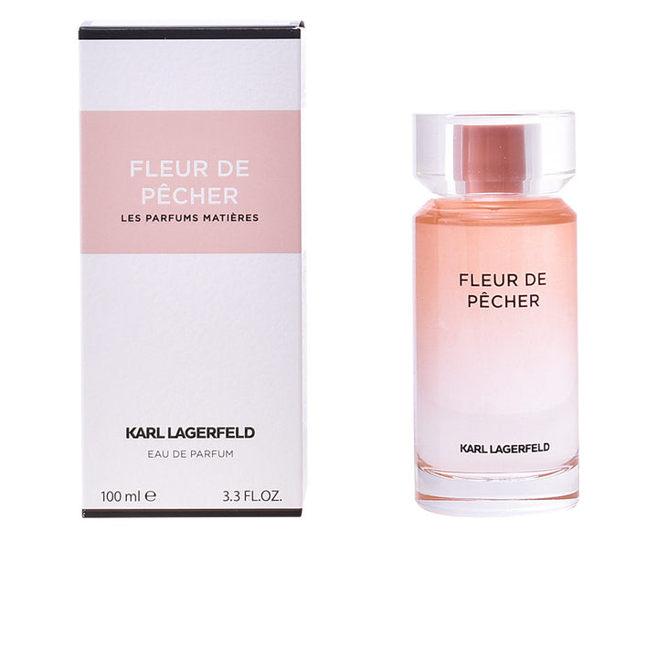 Clear cylindrical 100 ml perfume bottle with pale pink atomiser and floral-fruity scent