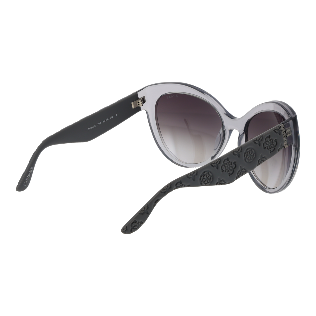 Gray cat-eye sunglasses on neutral background showing embossed temples and gradient lenses