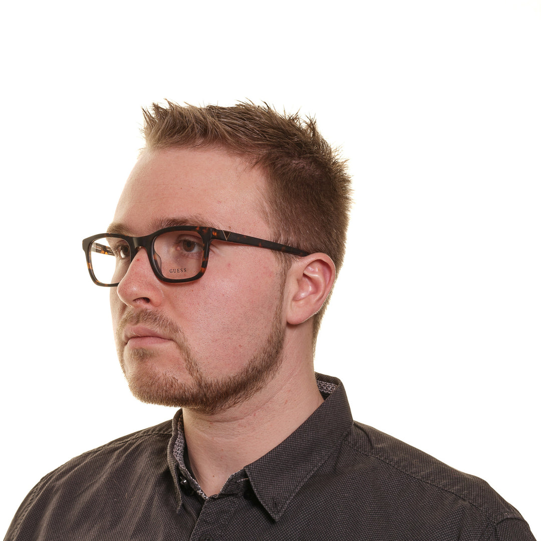 Unisex tortoiseshell full-rim rectangular eyeglasses in brown-black pattern with small metal temple detail