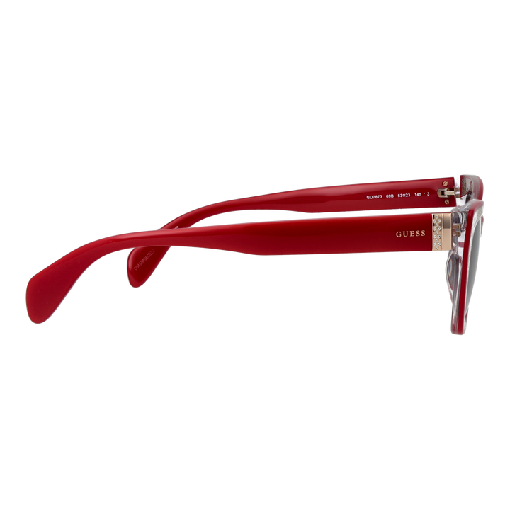 Red and black textured cat-eye sunglasses with gradient grey lenses and decorative gold chain over a neutral background