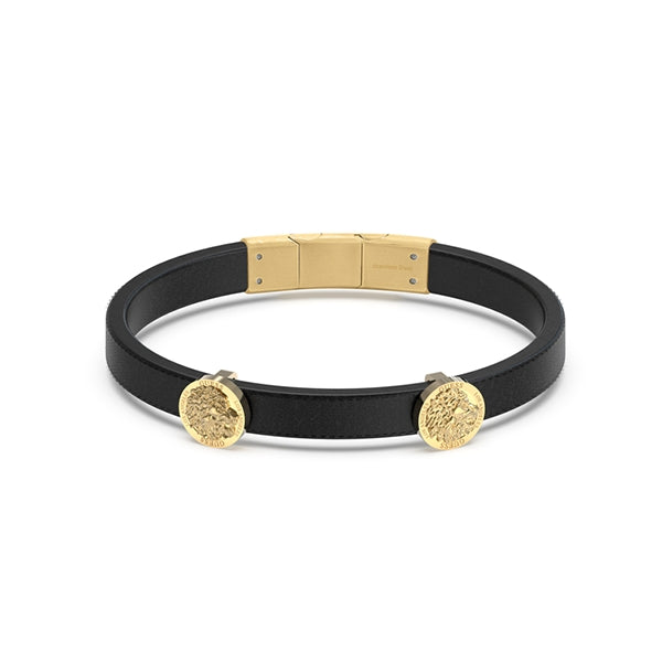 Black leather bracelet with two gold coin charms and a polished gold clasp on neutral background