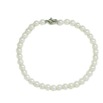 Classic pearl necklace of round white pearls strung with a silver metal clasp, photographed on neutral background