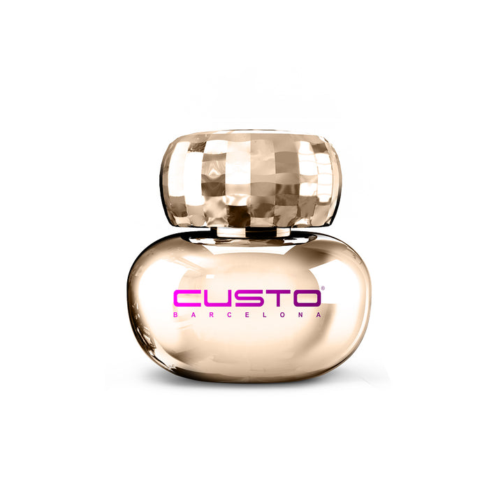 Rounded rose‑gold glass perfume bottle with faceted cap, 100 ml floral‑woody scent
