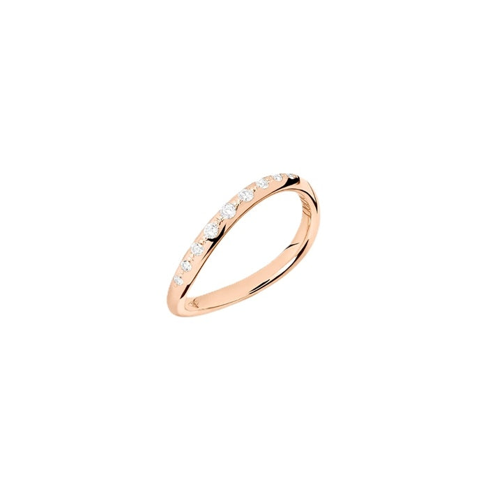 Rose gold stacking ring with embedded diamonds and polished finish on neutral background